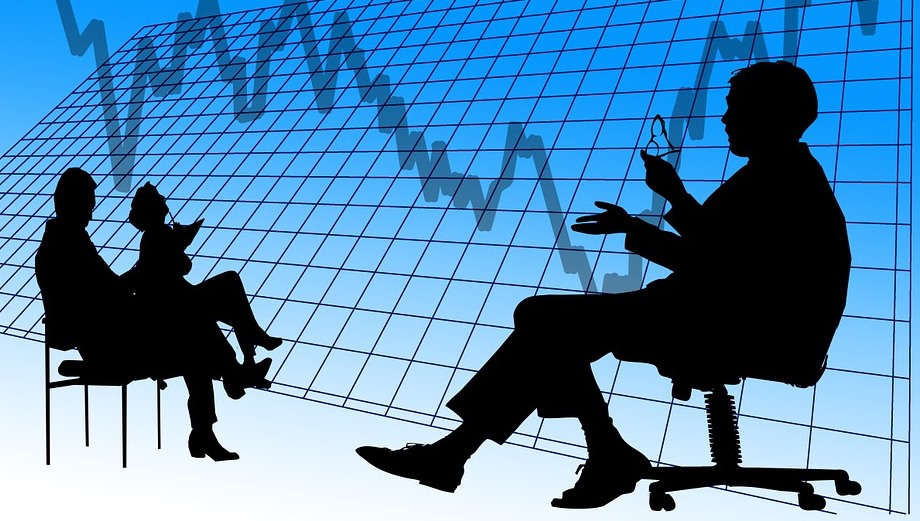 Silhouette of trader and graph
