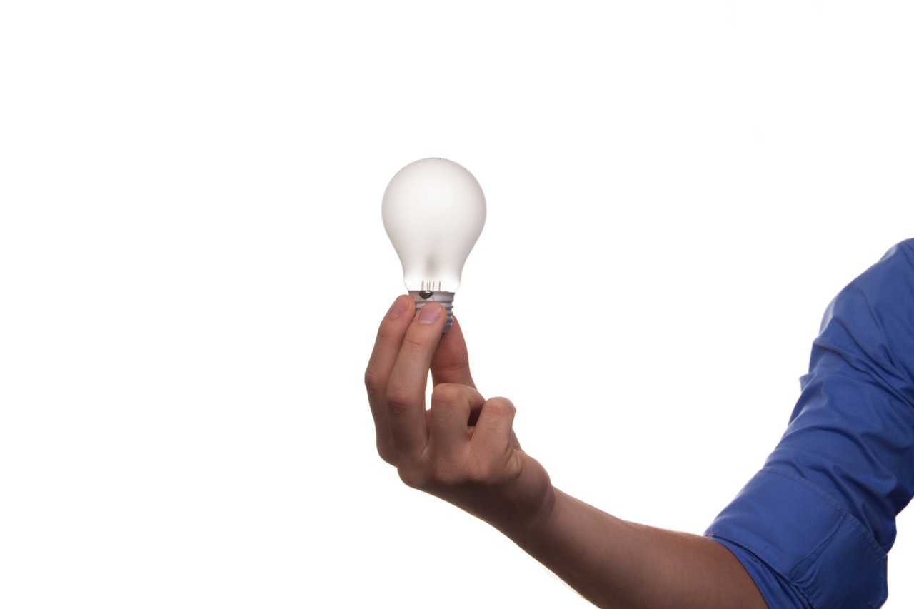 a person holding a bulb